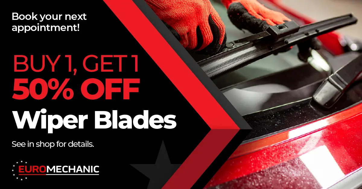 A person wearing red gloves installs a wiper blade on a car windshield. Text reads: Buy 1, Get 1 50% Off Wiper Blades at Bloor West Auto. Book your next appointment! See in shop for details. Euromechanic—your go-to for auto repair Mississauga. EuroMechanic - Bloor West Auto | Top Reviewed Auto Repair Shop in Mississauga | Visit EuroMechanic - Bloor West Auto